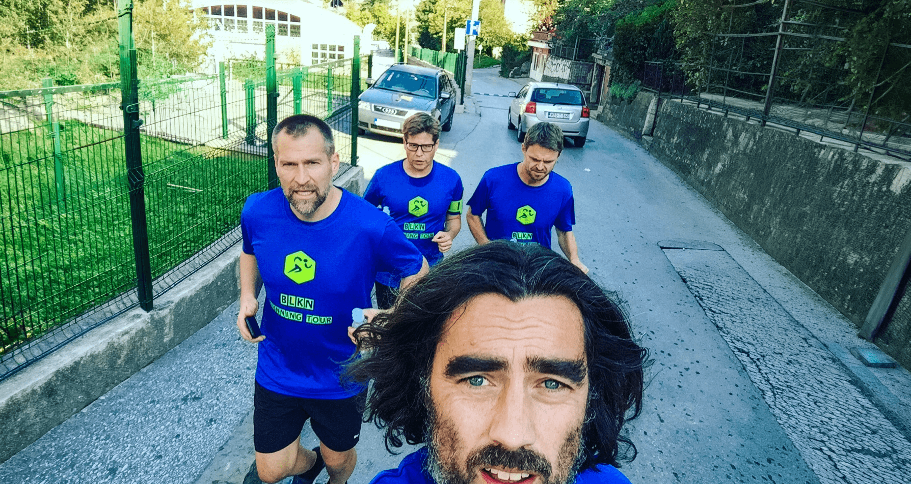 The four of us, mid-run — Johan's selfie in front, the other three behind